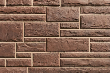 Surface with brown tiles with a stone texture for the exterior.