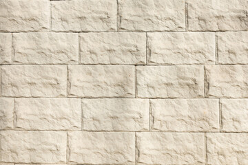 Surface with white tiles with a stone texture for the exterior