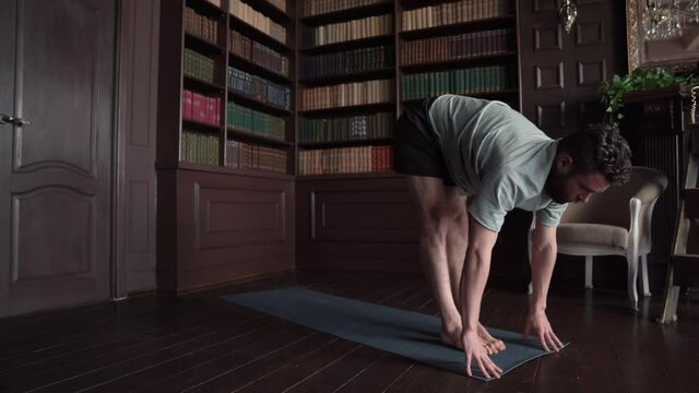 Athletic Yoga Teacher Practising Yoga Exercises at Home