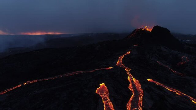 Flying over rivers of lava revealing shot Iceland volcano 2021