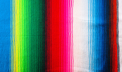 Cinco de mayo background decorated image made from mexican blanket stripes or poncho serape background.