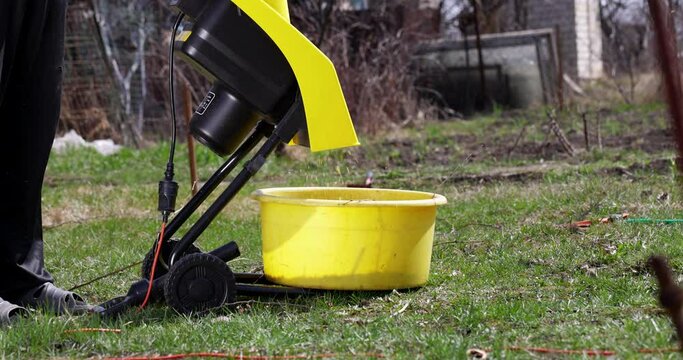 Gardening Chopping machine Tools Shredding machine Slow motion Falling sawdust Mulching Gardening tools Equipment International workers day Tree branches Work person Country house Dacha Garden Season