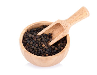 black pepper on wooden bowl isolated over white background