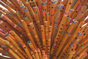 close up of a bunch of bamboo flutes