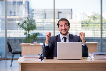 Fototapeta premium Young businessman employee working in the office