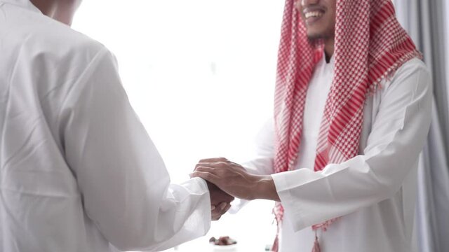 portrait of business muslim partner shaking hand in the meeting