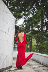 Shot of  a beautiful lady wearing a red dress behind  the camera