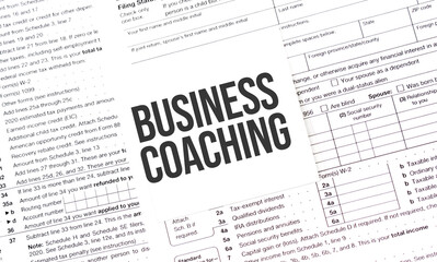 Yellow Paper Note With Words business coaching , Tax concept