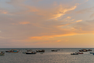 horizon of the sea from Praia do Forte - Bahia with boats in late afternoon
