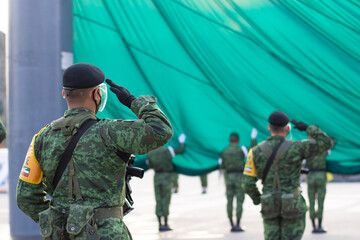 soldiers raising flag