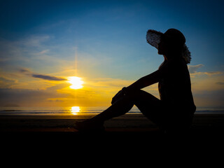 Lonely woman sitting alone moments sunset .are Lovely. Style abstract shadows.