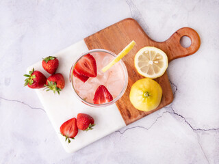 strawberry and lemon summer cocktail flatlay