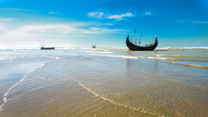 Boat by the sea in blue sky