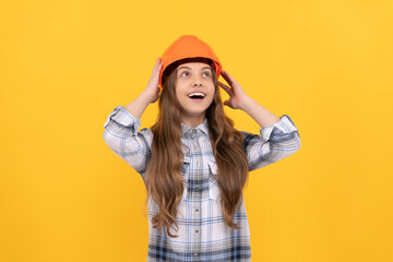 happy teen girl in helmet and checkered shirt, architect