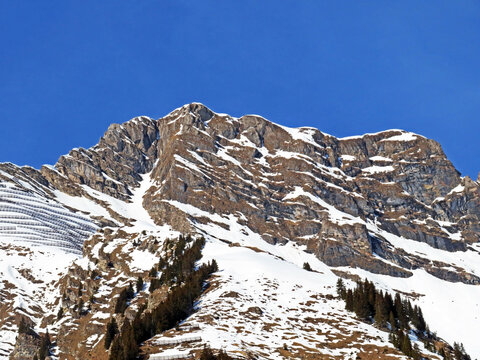 Snowy alpine mountain peak La Tarent located in a mountain massif of the Bernese Alps (Alpes bernoises), Les Diablerets - Canton of Vaud, Switzerland (Suisse)