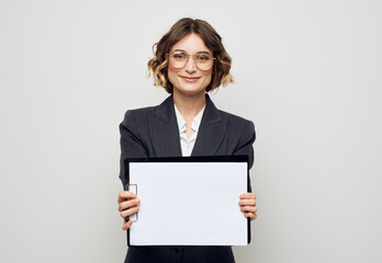 Fototapeta premium Business woman in classic suit white sheet of paper mock-up office work