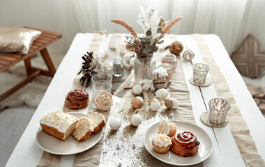 Festive table for Easter with decor details and homemade cakes.