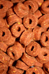 A top view shot of a manufactured dry dog round with hole croquette food modern background high quality big size print
