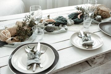 Stylish table setting for two with decor details.