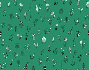A pattern of silhouettes of small different flowers on green background. vector illustration