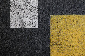asphalt texture background, asphalt background with lines, white and yellow lines on a dark grey street, space for text, no person