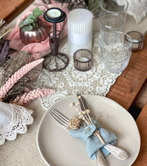 Close up of table setting with decorative details in vintage style.