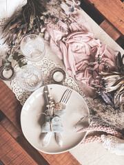 Close up of table setting with decorative details in vintage style.