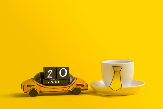 Cup with tie and wooden typewriter with Father's Day celebration date June 20th. Father's Day gift for Dad. Happy Father's Day holiday concept in 2021. - Powered by Adobe