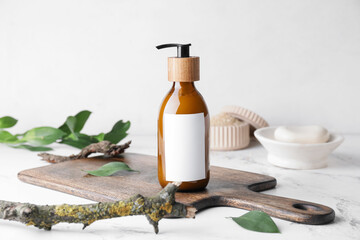 Bottle with natural shampoo on light background - obrazy, fototapety, plakaty