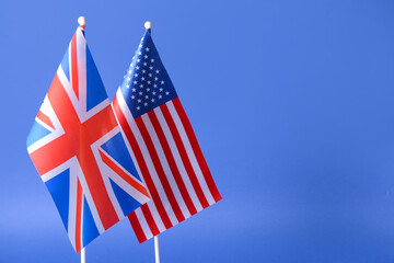 Flags of USA and Great Britain on color background