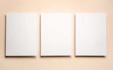 Blank sheets of paper on color background