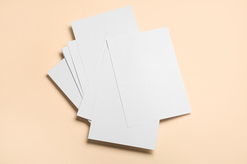 Blank sheets of paper on color background