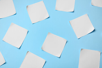 Blank sheets of paper on color background