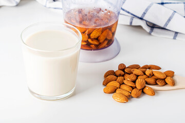 Step by step recipe. Cooking nuts vegetable milk. Step 3 cooked  almonds milk in glass. Homemade food concept. Plant based organic veggie milk, lactose free