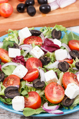 Fresh greek salad with feta cheese and vegetables as healthy meal containing vitamins and minerals