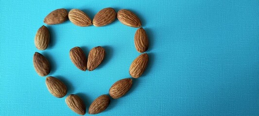 Almond heart on a blue background. Blue banner with a walnut heart.