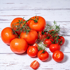 Tomatoes on a branch with dill, water drops, on a white table close-up, copy space, template,