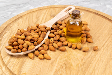 bottle of apricot seed oil prunus armeniaca oleum on a concrete background
