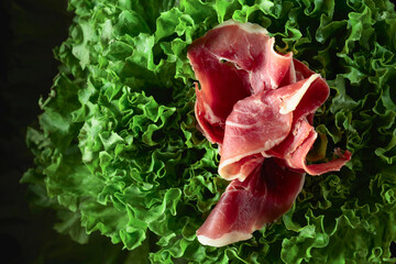 Prosciutto and fresh lettuce.