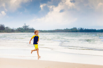 Kids playing on beach. Children play at sea.