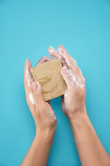 In female hands handmade soap, hands in foam. Disinfection, protection against viruses and bacteria.