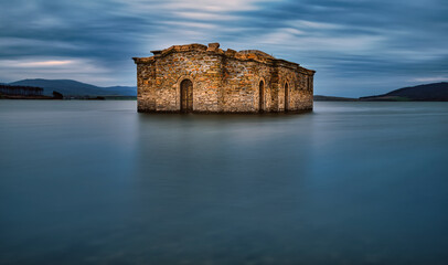 Fototapeta na wymiar St. Ivan Rilski ”, also called the Submerged Church, is a church in the village of Zapalna which was submerged in 1965 during the construction of the Zhrebchevo dam. 