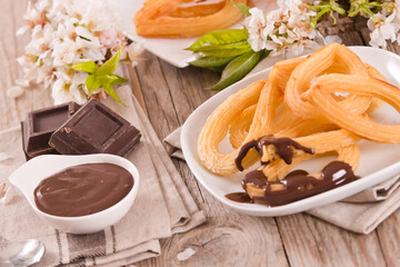 Churros with chocolate dipping sauce.