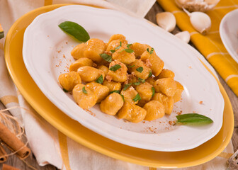 Pumpkin gnocchi with grated amaretti cookies. 