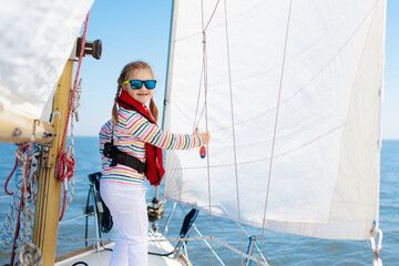 Kids sail on yacht in sea. Child sailing on boat.