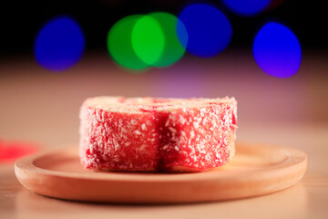 Red velvet cake on a wooden plate
