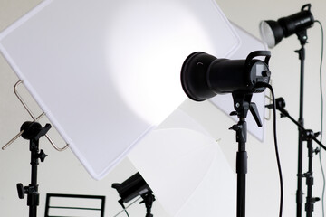 Photo or video studio with white soft screen and light equipments for shooting