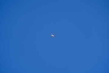 Drone up in the air with blue sky in the background. Photo taken April 14th, 2021, Rigi Kulm, Switzerland.