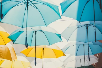 Fotobehang rainy season concept, umbrella use for sunshade public space decoration pattern background © Quality Stock Arts
