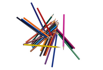Many colored pencils in a heap on a white background.